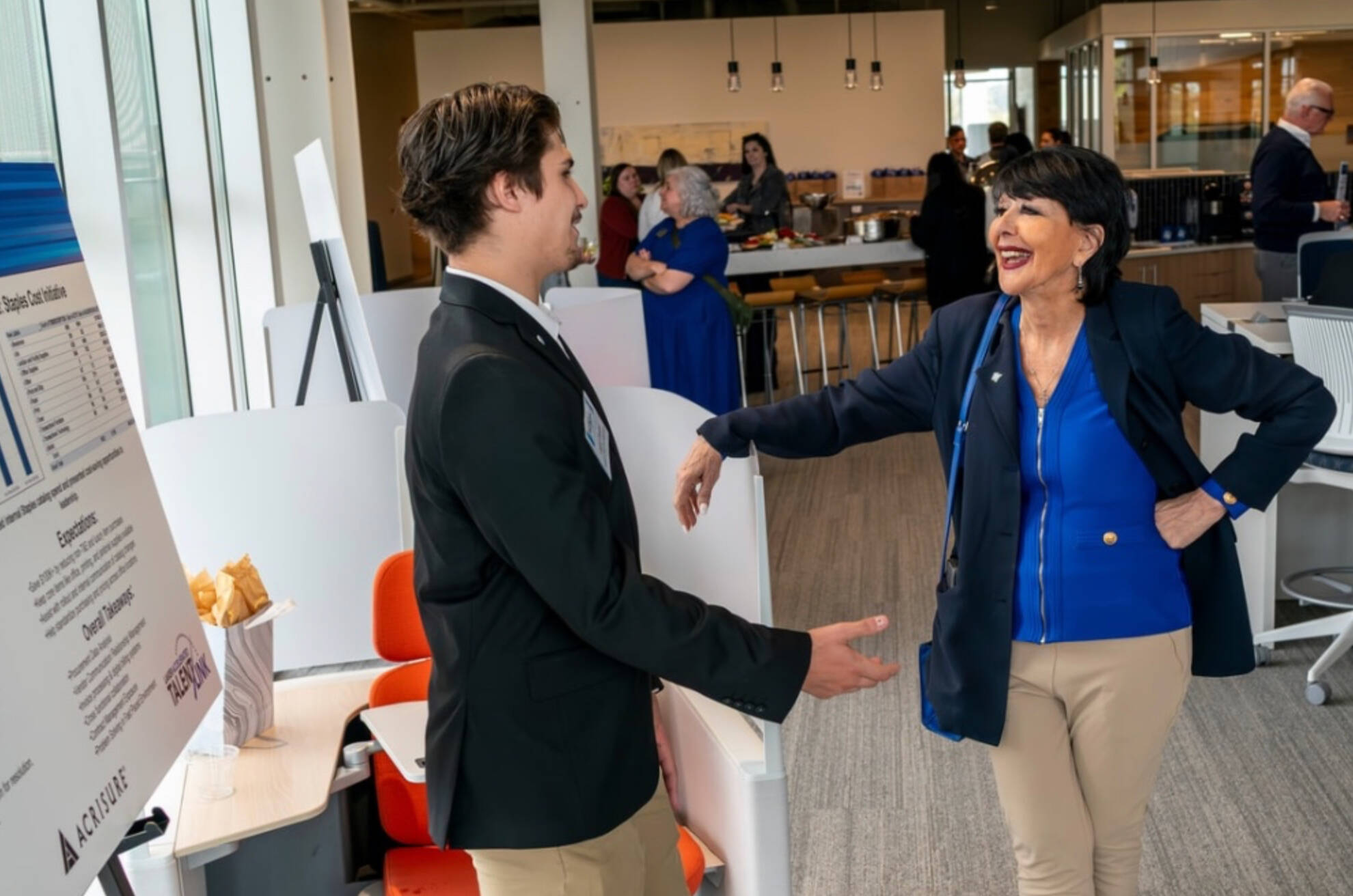 Student talking to the President of GVSU